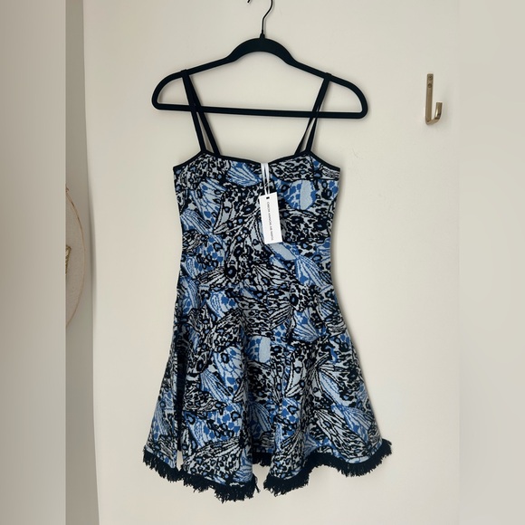 Torn by Ronny Kobo Dresses & Skirts - Viral Torn by Ronny Kobo Blue Butterfly Patterned Stretchy Flare Mini Dress